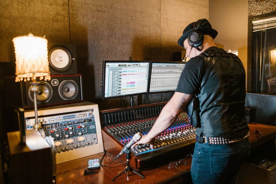 Music producer working in a recording studio for label services
